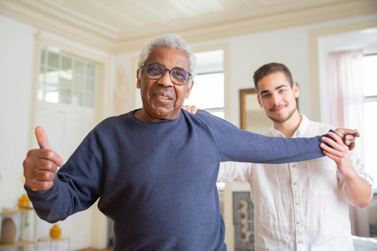 Senior receiving friendly home care support